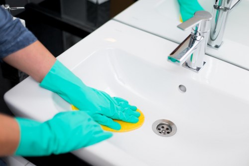 Technician performing upholstery cleaning in a SE22 property